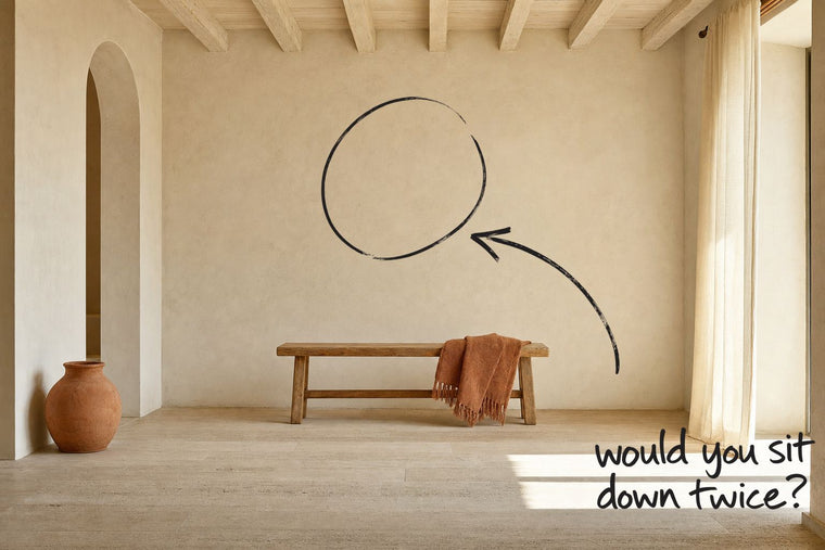A wooden bench standing at viewing distance from a completely bare plaster wall, the bare wall the bench faces circled in open black marker, an arrow from the handwritten words would you sit down twice, by Willem van der Krieken