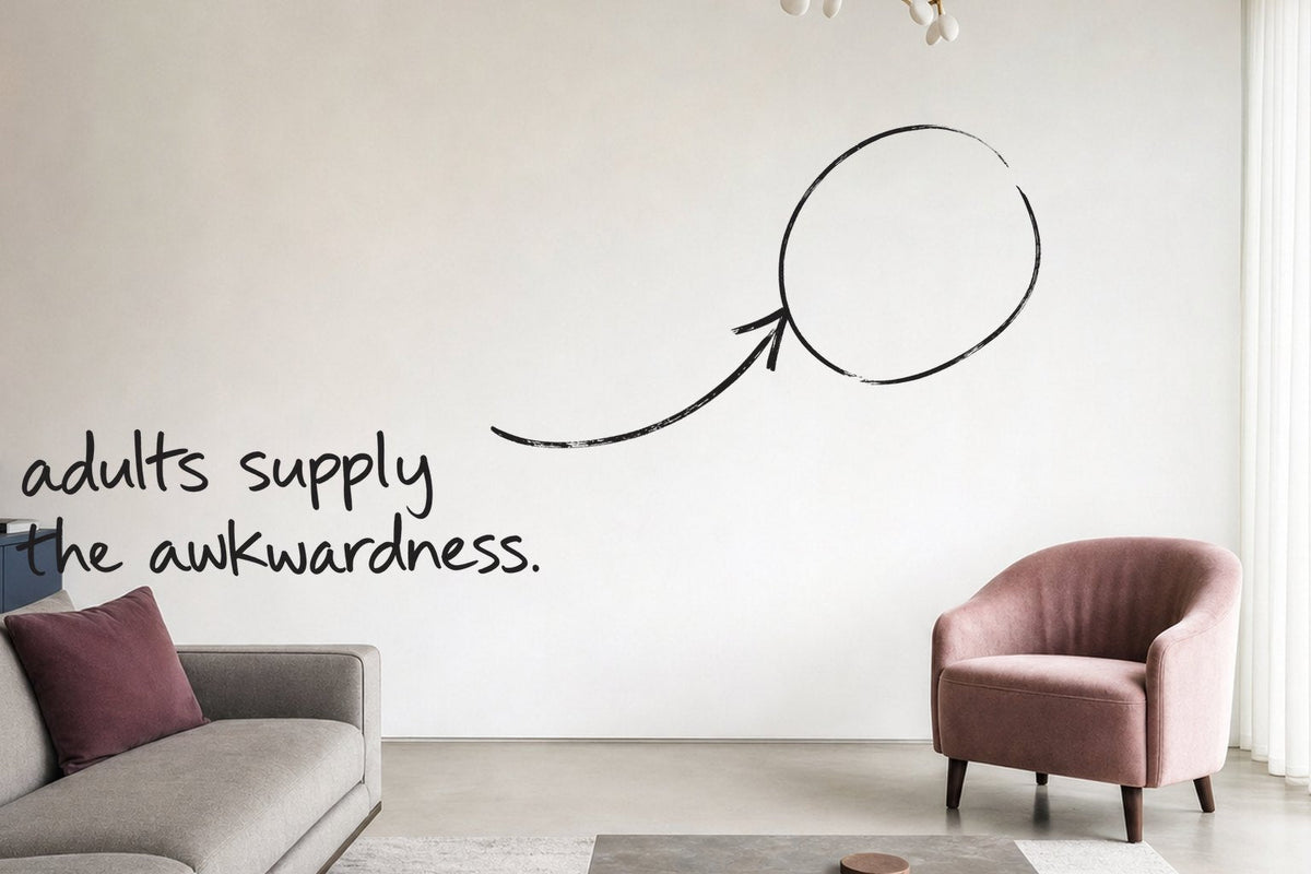 A bright apartment living room with a slate blue sideboard and a dusty pink chair, the empty wall circled in open black marker, an arrow from the handwritten words adults supply the awkwardness, by Willem van der Krieken