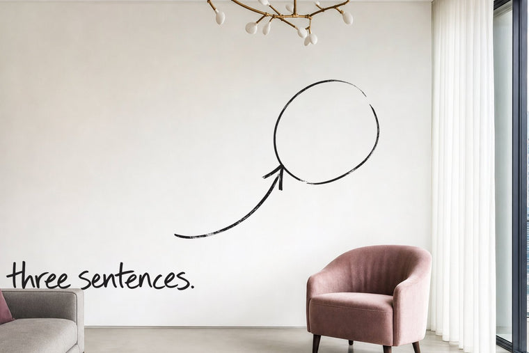 A bright apartment living room with a slate blue sideboard and a dusty pink chair, the empty wall circled in open black marker, an arrow from the handwritten words three sentences, by Willem van der Krieken