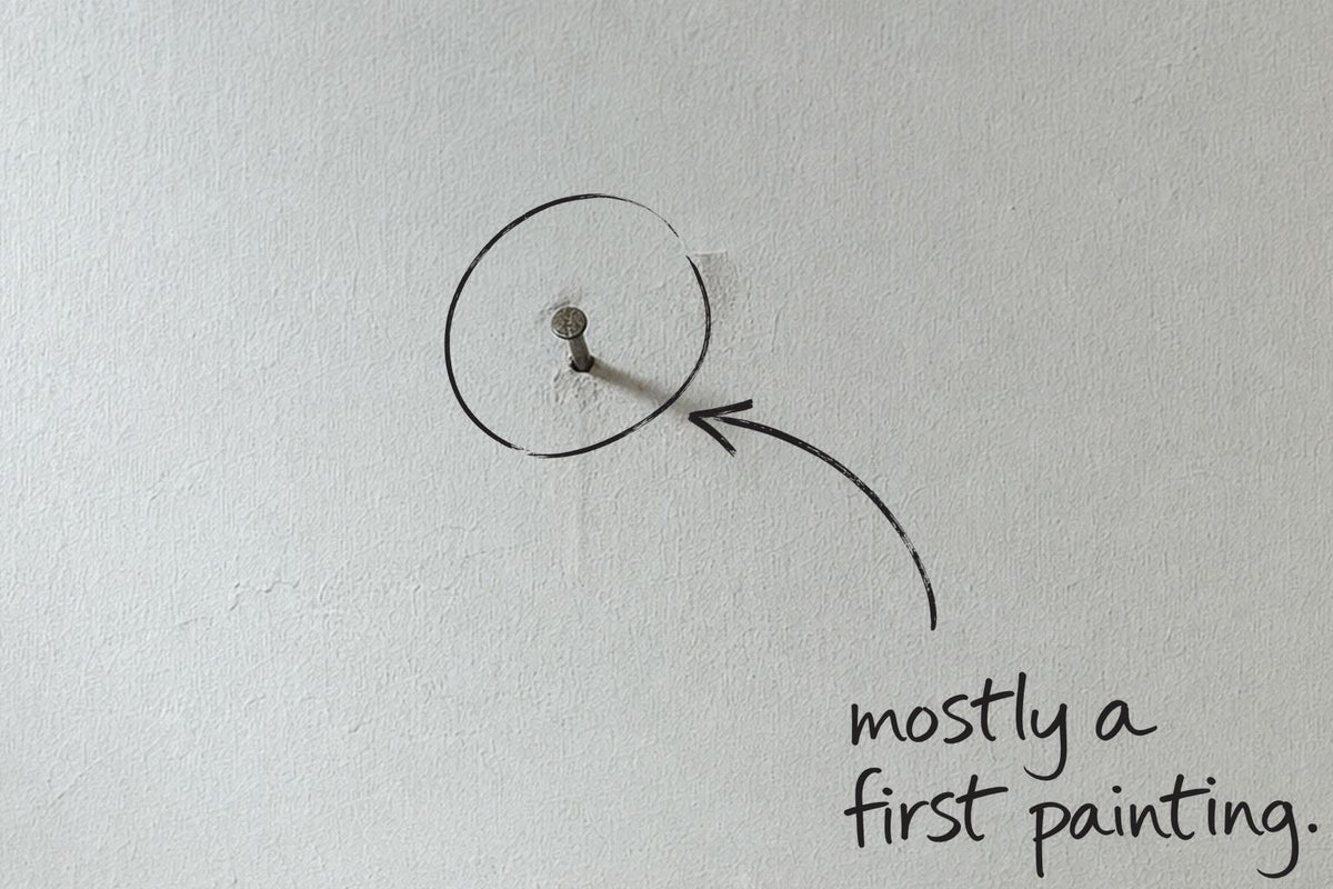 A single nail left in a bare plaster wall, fresh dust below it, the nail circled in open black marker, an arrow from the handwritten words mostly a first painting, by Willem van der Krieken